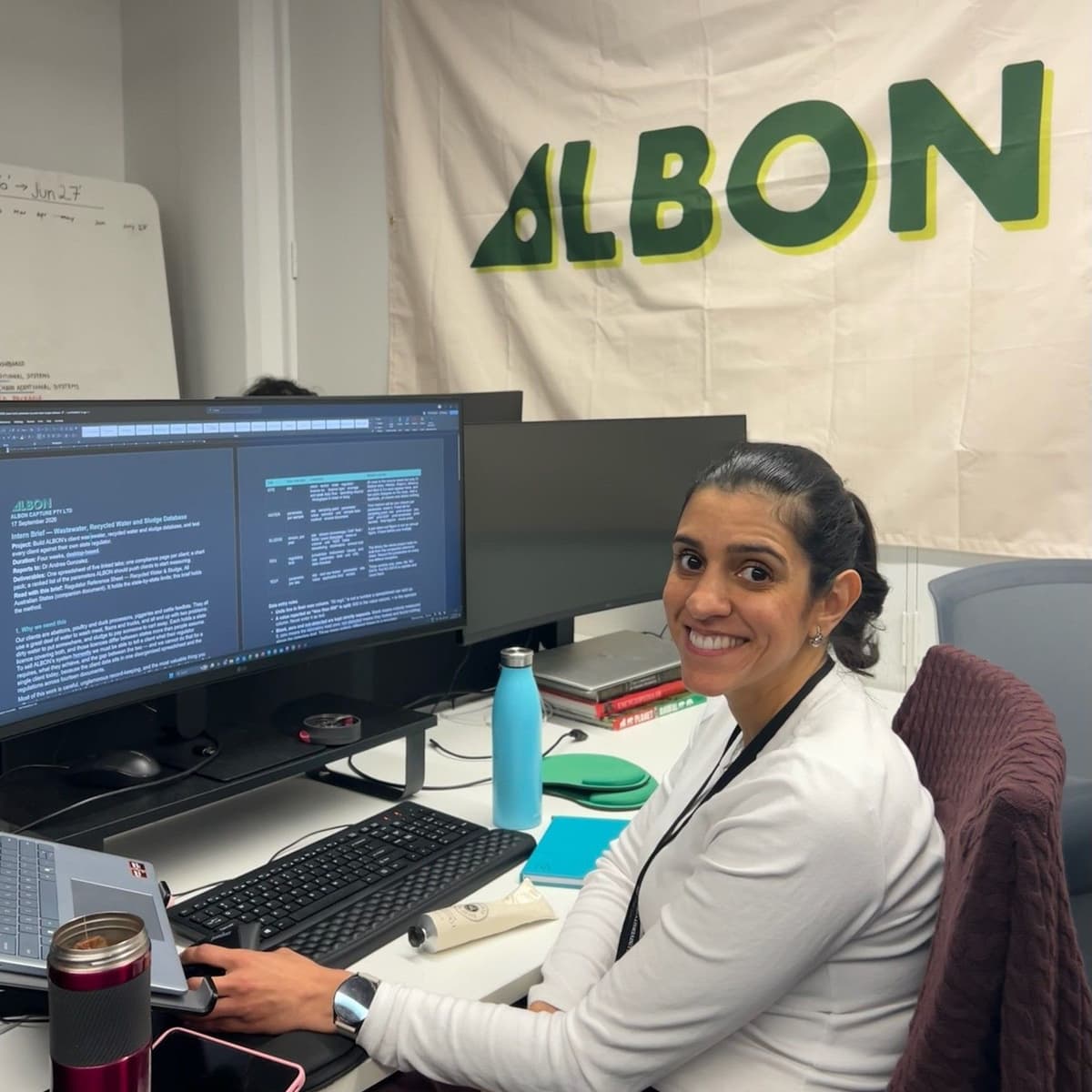 Co-Founder Dr Andrea Gonzalez in the ALBON office, with ultrawide LG monitors