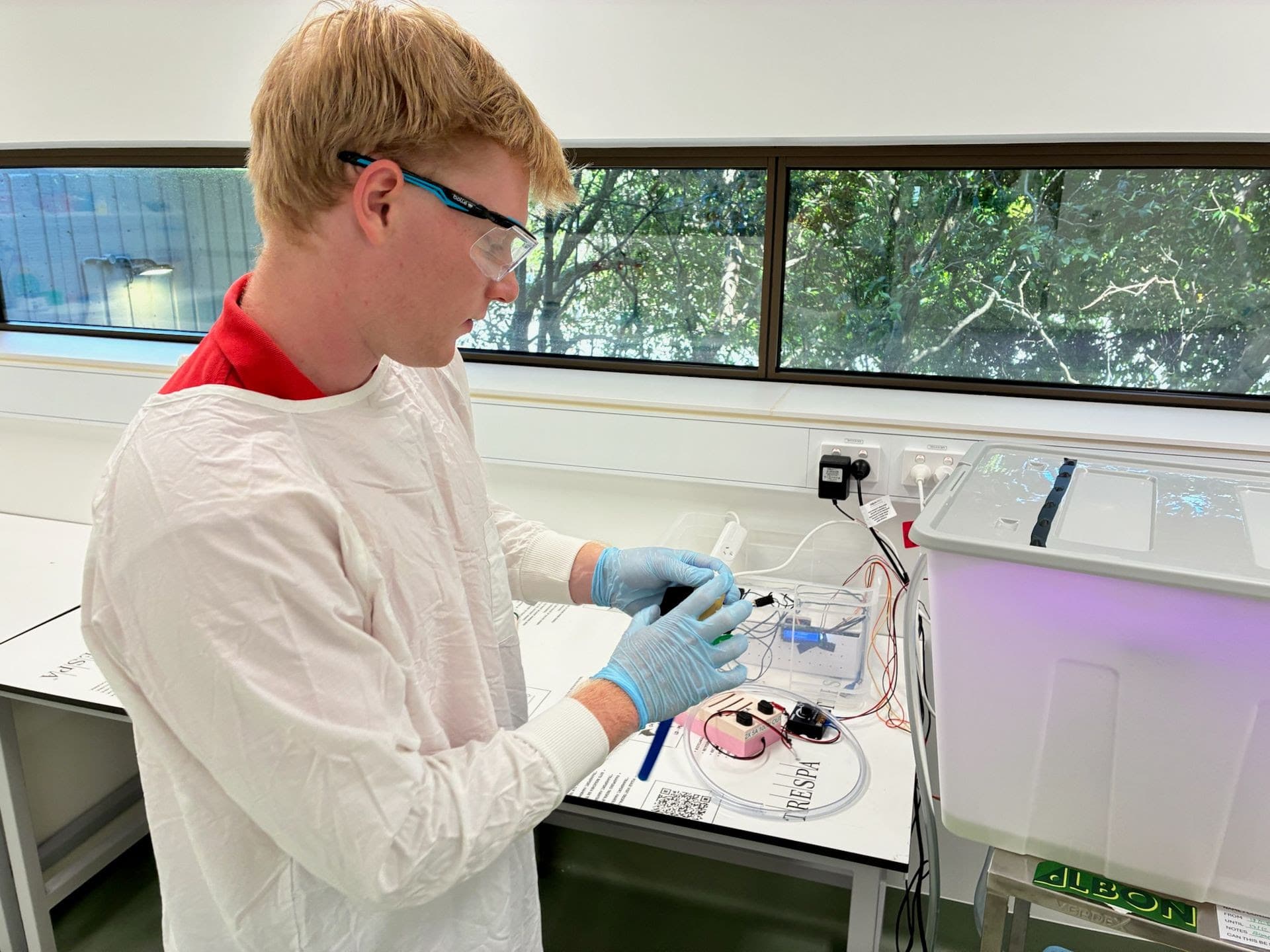 Lead Electrical Engineer Sam McKid fine-tuning our benchtop reactor